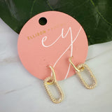 Sleek gold-tone drop earrings featuring modern rectangular chain links with a polished finish, and a sparkling link creating a bold yet refined statement for everyday or evening wear.