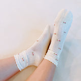 Charming set of two socks featuring delicate vintage-inspired floral patterns—perfect for adding a touch of timeless elegance to your everyday look.