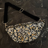 floral sling bag with adjustable strap and front zipper, available in Cherry Meadow, Indigo Bloom, and Midnight Daisy prints