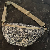 floral sling bag with adjustable strap and front zipper, available in Cherry Meadow, Indigo Bloom, and Midnight Daisy prints