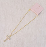 Gold-tone necklace featuring a vintage-inspired cross pendant adorned with sparkling crystals for a timeless and elegant look.