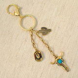 Keychain with cow skull, cactus, hat and turquoise charm – western style