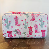 Compact cosmetic case with a playful Western-inspired design, ideal for daily use—featuring a zip closure and spacious interior to keep your beauty essentials organized in style