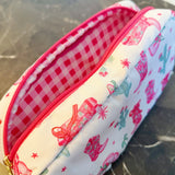 Compact cosmetic case with a playful Western-inspired design, ideal for daily use—featuring a zip closure and spacious interior to keep your beauty essentials organized in style