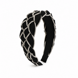 Black headband with silver braided design on a white background