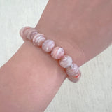 Faceted glass stretch bracelet available in soft blue or peach – pastel shine and stackable charm