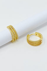 Boucles d'oreilles Huggie triple brillance
