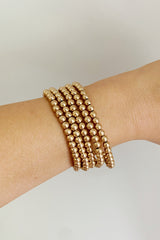 Conjunto de pulsera de cuentas doradas