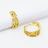 Boucles d'oreilles Huggie triple brillance