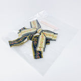 Conjunto de pasador con lazo bordado parisino