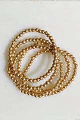Conjunto de pulsera de cuentas doradas
