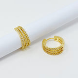 Boucles d'oreilles Huggie triple brillance