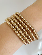 Conjunto de pulsera de cuentas doradas
