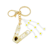 Porte-clés initial bébé marguerite