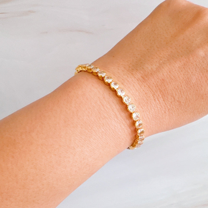 Adjustable rope-style tennis bracelet featuring round bezel-set cubic zirconia stones, offering a modern blend of shimmer and sporty sophistication.