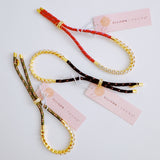 Adjustable rope-style tennis bracelet featuring round bezel-set cubic zirconia stones, offering a modern blend of shimmer and sporty sophistication.