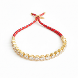 Adjustable rope-style tennis bracelet featuring round bezel-set cubic zirconia stones, offering a modern blend of shimmer and sporty sophistication.