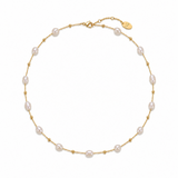 Pearl necklace with gold chain on a white background