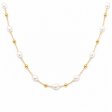 Gold chain necklace with pearls on a white background