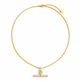 A gold chain necklace featuring a sparkling pavé T-bar pendant. The design combines a classic toggle motif with shimmering details for a sophisticated and modern finish.