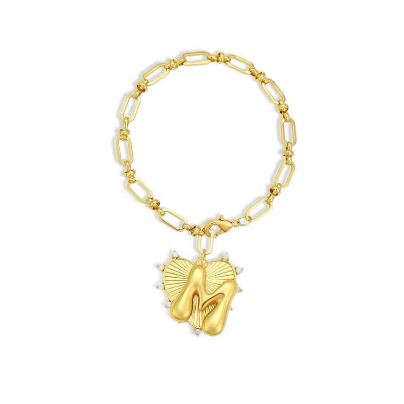 Gold chain bracelet with a heart-shaped charm and initial letter M over the heart charm on a white background