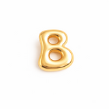 Glossy, balloon-style metal initial brooch pins in a playful, rounded design, available in multiple letters with a puffy, dimensional shape and metallic finish.