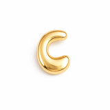 Glossy, balloon-style metal initial brooch pins in a playful, rounded design, available in multiple letters with a puffy, dimensional shape and metallic finish.