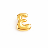 Glossy, balloon-style metal initial brooch pins in a playful, rounded design, available in multiple letters with a puffy, dimensional shape and metallic finish.