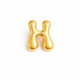 Glossy, balloon-style metal initial brooch pins in a playful, rounded design, available in multiple letters with a puffy, dimensional shape and metallic finish.