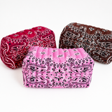 Three pouches with a paisley bandana pattern, displayed on a clean white background. The pouches are in pink, red, and brown colors.