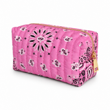 a bandana print pink cosmetic case with gold zipper on white background