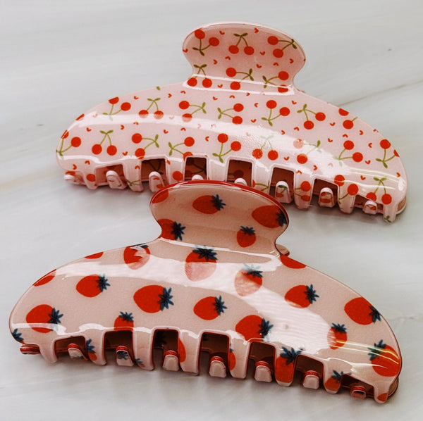 Set of two cherry-themed hair claws with vibrant berry and cherry motifs.