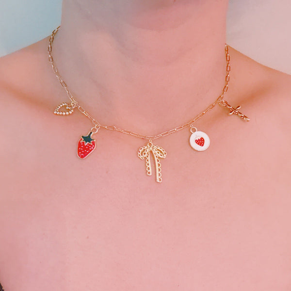Gold charm bracelet with strawberry, heart and bow – romantic playful bracelet