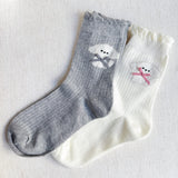 Set of two crew-length socks featuring charming embroidered Bichon Frise puppy design. Each pair showcases a soft color and is crafted from a stretchy & cozy material, perfect for everyday wear with a playful and cute flair.