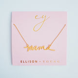Gold chain necklace featuring the word “Mama” in a large, bold cursive font, designed to make a statement with a heartfelt touch.