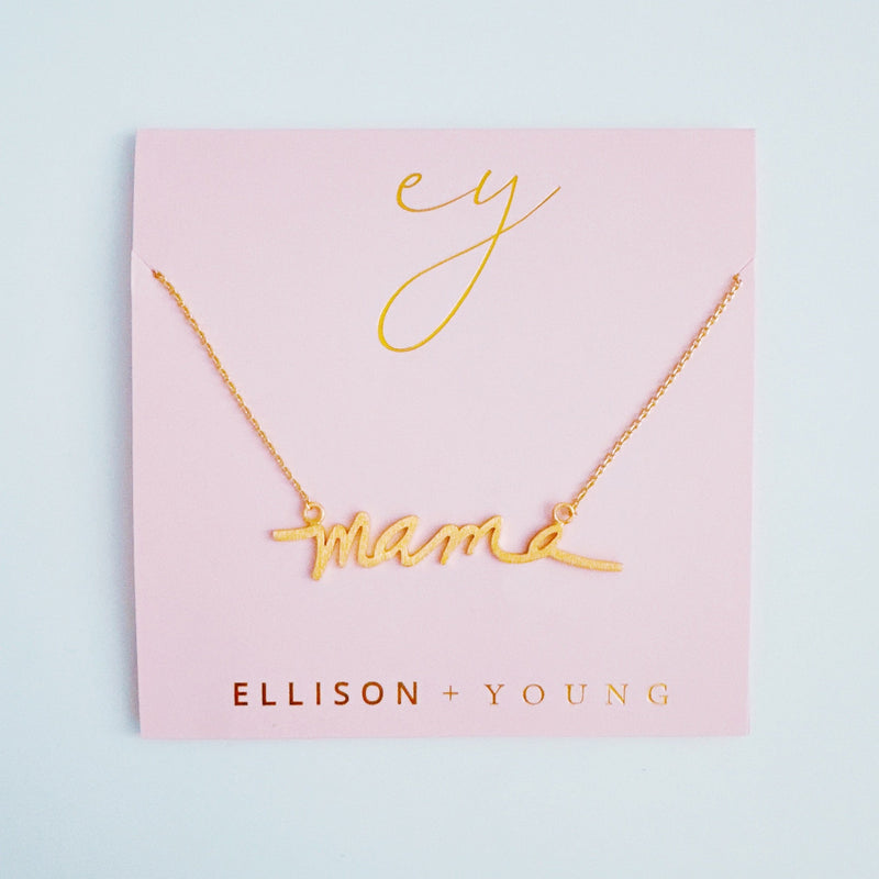 Gold chain necklace featuring the word “Mama” in a large, bold cursive font, designed to make a statement with a heartfelt touch.