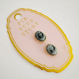 Set of two magnetic brooch pins or earrings featuring a classic black cameo silhouette with an elegant profile design, perfect for adding a vintage-inspired accent to scarves or other styled accessories.