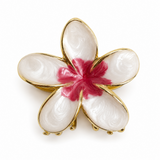 Flower shaped hair claw with gold outline with marbled white enamel with pink center