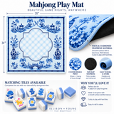 Blue and white Mahjong play mat with traditional Chinese garden illustrations, shown with matching tiles and product feature callouts on a white background.