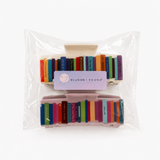 Packaged colorful hair clips with Ellison Young label on a white background