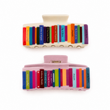 Two hair clips with colorful book spines design on a white background