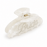 White hair clip with decorative elements on a white background