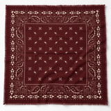 A square bandana in deep burgundy with a cream paisley border and matching cream printed motifs, laid flat against a white background.