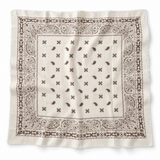 A square cream-colored cotton bandana featuring a classic brown paisley pattern and border, laid flat against a white background.