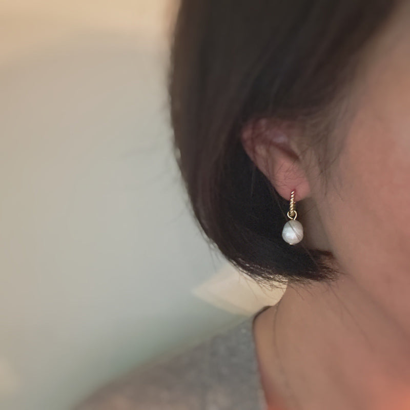 Gold cabled huggie hoop earrings with natural freshwater pearls – elegant and minimalist design