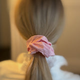 Set of two hair scrunchies featuring bold checkered patterns with elegant trailing ribbons—perfect for adding a playful yet polished touch to any hairstyle.