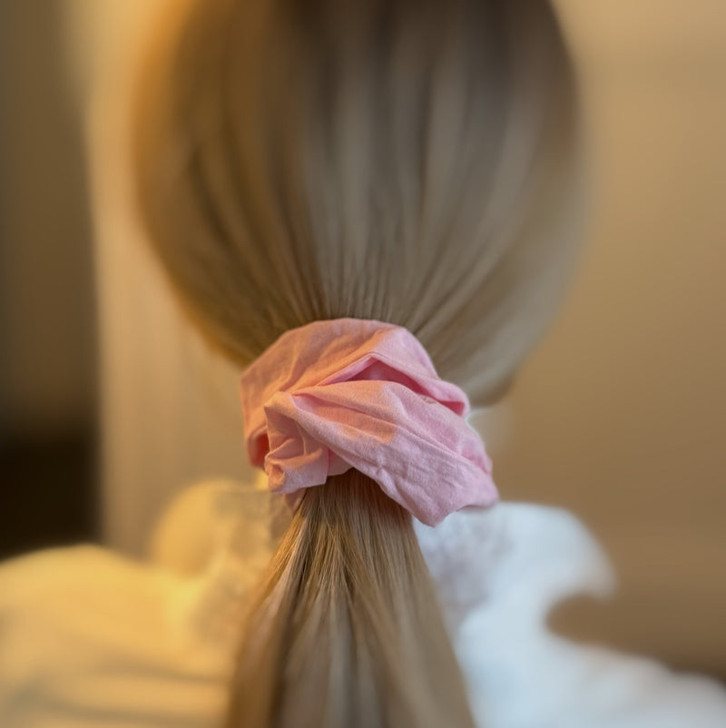 Set of two hair scrunchies featuring bold checkered patterns with elegant trailing ribbons—perfect for adding a playful yet polished touch to any hairstyle.