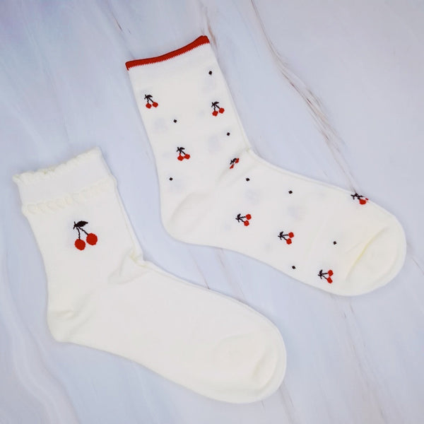  Fun and fruity set of two pairs of socks featuring playful cherry patterns—perfect for adding a pop of color and charm to your everyday wardrobe.