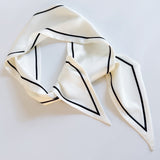 Elegant ribbon-style scarf with contrasting edges, perfect for adding a refined touch to hairstyles, handbag handles, or necklines.