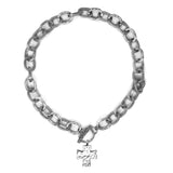 Silver chain bracelet with a cross charm on a white background